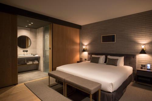 Postel nebo postele na pokoji v ubytování HOTEL CANATA KYOTO