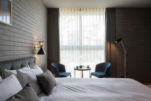 Postel nebo postele na pokoji v ubytování HOTEL CANATA KYOTO