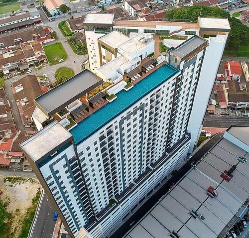 an overhead view of a large building with a swimming pool at The Horizon @ Ipoh - Cozy Condo with Balcony Patio in Ipoh
