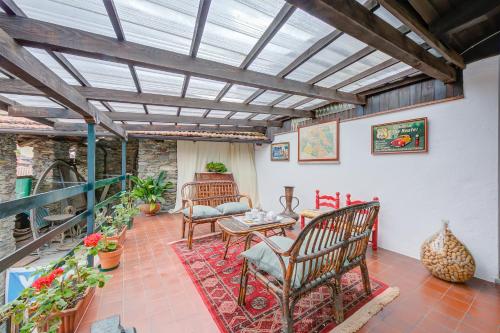 a living room with chairs and a table at Residenza La Lanterna Pool and Relax - Happy Rentals in Gignese