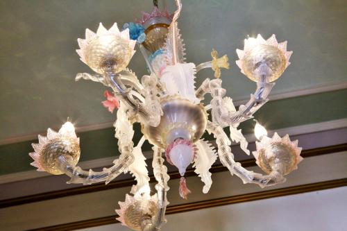 a chandelier hanging from a ceiling with shells on it at Villa Ducale Hotel & Ristorante in Dolo