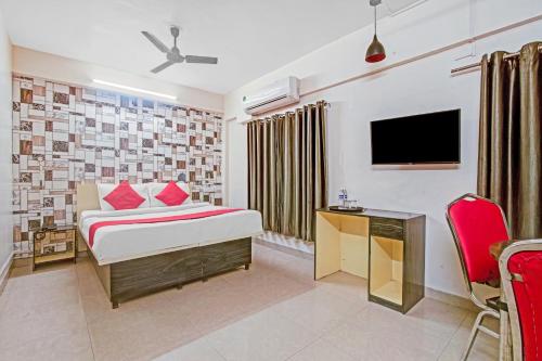 Tempat tidur dalam kamar di OYO Flagship 74330 Hotal Aqsha Paradise