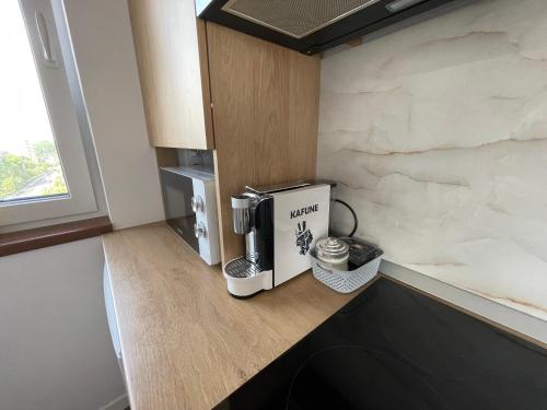 a kitchen with a coffee maker on a counter at Apart 72 in Baia Mare