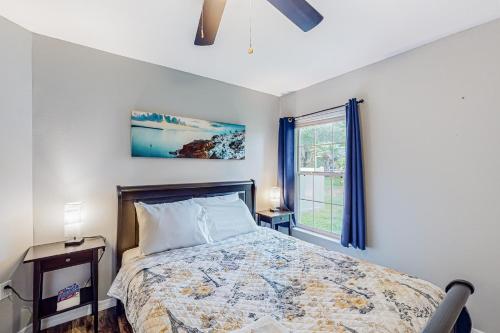a bedroom with a bed and a window at Sunkissed in Kissimmee in Kissimmee