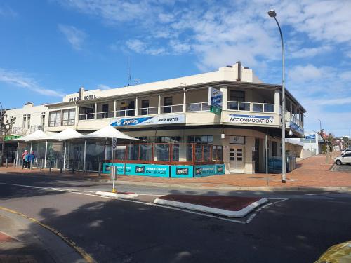 a building on the corner of a city street at Pier Hotel in Port Lincoln