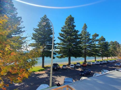 a view of a parking lot with trees and cars at Pier Hotel in Port Lincoln