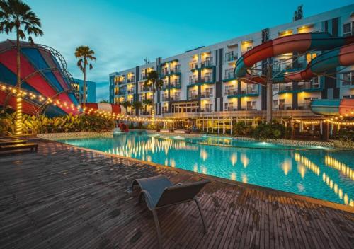a resort with a water slide and a roller coaster at Astara Hotel Balikpapan in Balikpapan