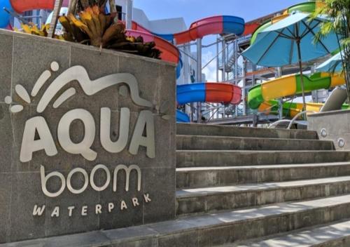 a sign for aaru room water park with a playground at Astara Hotel Balikpapan in Balikpapan