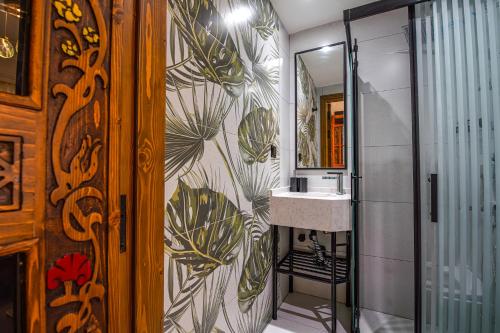a bathroom with a sink and a mirror at LinAsya Bozcaada in Çanakkale