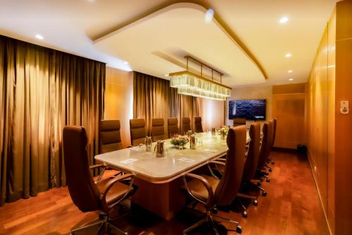a dining room with a long table and chairs at Hotel Himalaya in Kathmandu