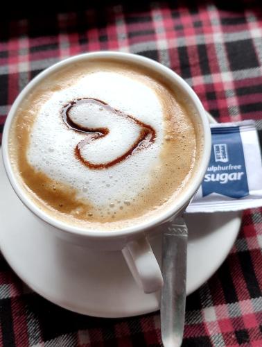a cup of coffee with the number two written on it at Mentokling Guest House and Garden Restaurant in Leh