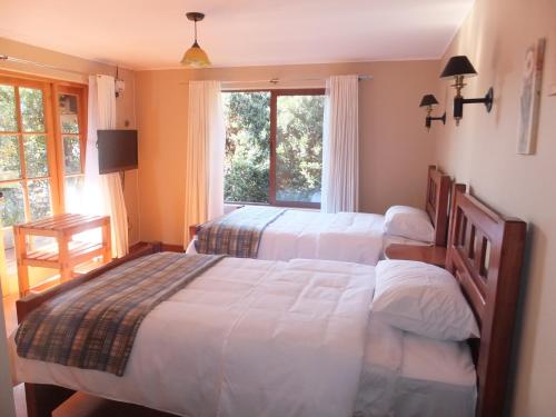 Ein Bett oder Betten in einem Zimmer der Unterkunft Casona el Sauce