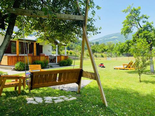 een schommel in de tuin van een huis bij Household Nikolic - Andrijevica, Montenegro in Andrijevica