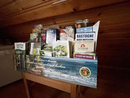 a table with books on top of it at B&B Des Bois Sans Nombre in Paliseul