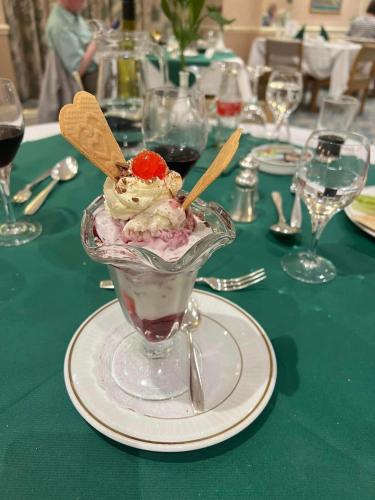 a dessert in a glass dish on a table at Saxonville Hotel in Whitby