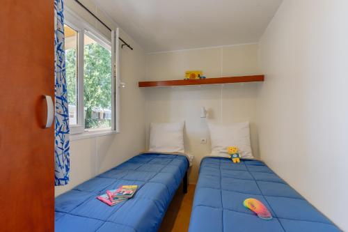 Posteľ alebo postele v izbe v ubytovaní Camping maeva Escapades Sun Océan