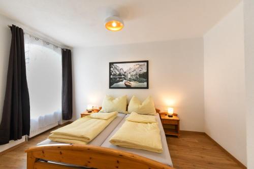 Giường trong phòng chung tại Ferienapartments 31erHaus