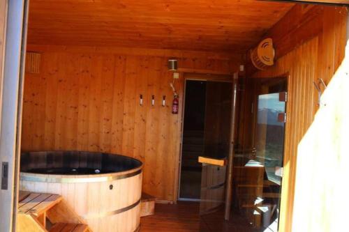 a wooden room with a large wooden tub in a room at Oxygene in Font-Romeu-Odeillo-Via