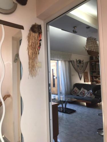 a mirror in a room with a living room at Givat Zeev - between Jerusalem and Tel Aviv, 25 minutes from the airport in Giv'at Ze'ev