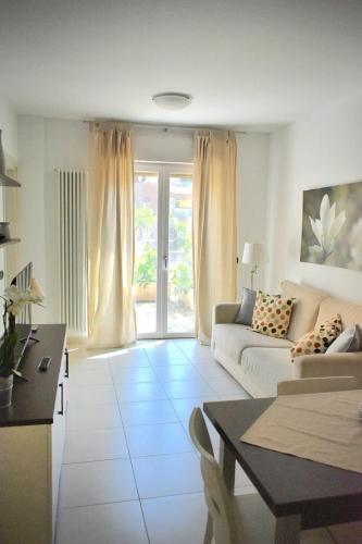 a living room with a couch and a table at bilocale Rachele in Sestri Levante