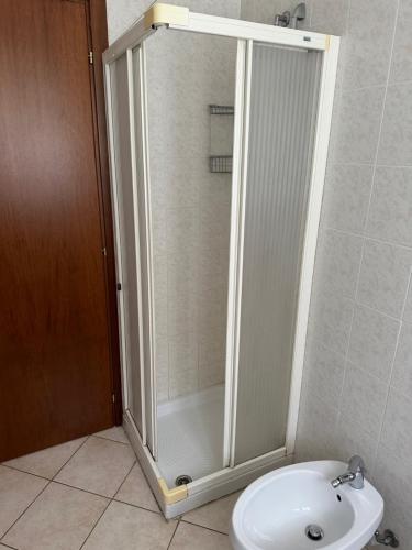 a shower in a bathroom with a toilet and a sink at Locanda Fungo Reale in Valloriate