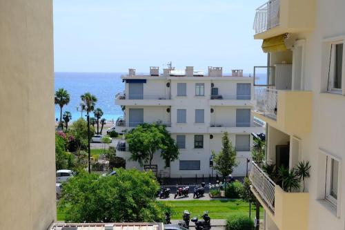 an apartment building with a view of the ocean at Cosy studio à 2 pas de la plage in Nice