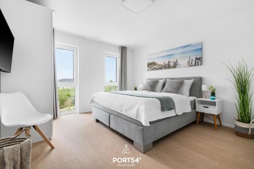 Postel nebo postele na pokoji v ubytování OstseeOase