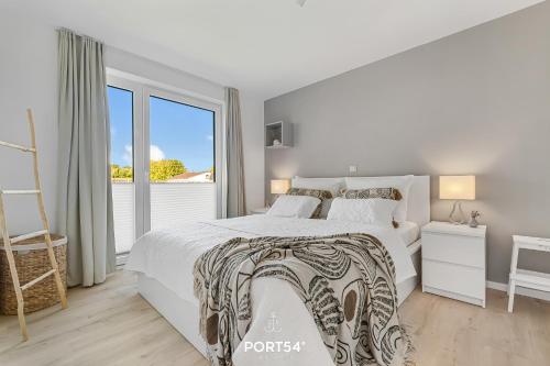 Postel nebo postele na pokoji v ubytování Ferienwohnung Engelsnest, App 9 Emmelsbüll