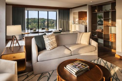 a living room with a couch and a table at Hyatt Regency Coralville in Coralville