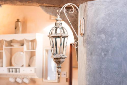 a lantern hanging from a wall in a kitchen at Snow Cottage laid back style with footpaths to a great Macro Brewery Pub 