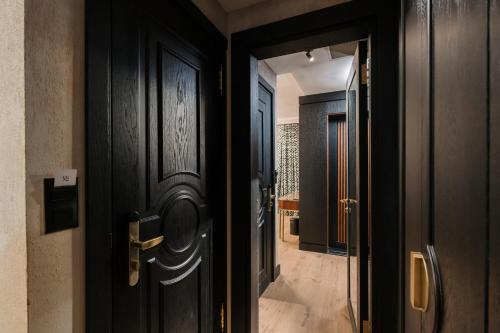 an open door to a hallway with a hallway leading into a house at Tria Elegance Istanbul in Istanbul