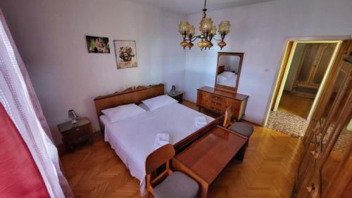 Apartment Belo tesisinde bir odada yatak veya yataklar