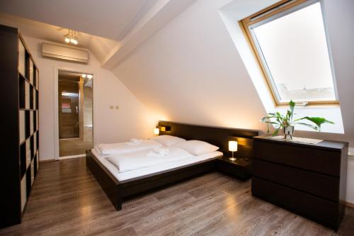 Postel nebo postele na pokoji v ubytování Hotel Litovel