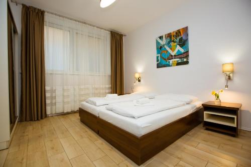 Postel nebo postele na pokoji v ubytování Hotel Litovel