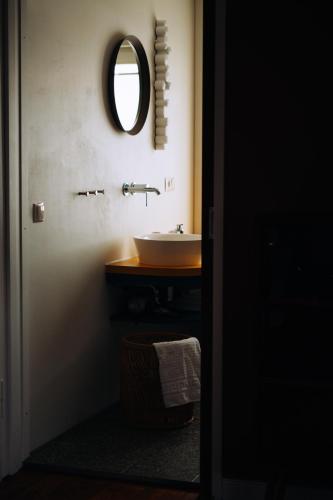 a bathroom with a sink and a mirror at Molo Rouge - Boutiquehotel & Café in Wunsiedel