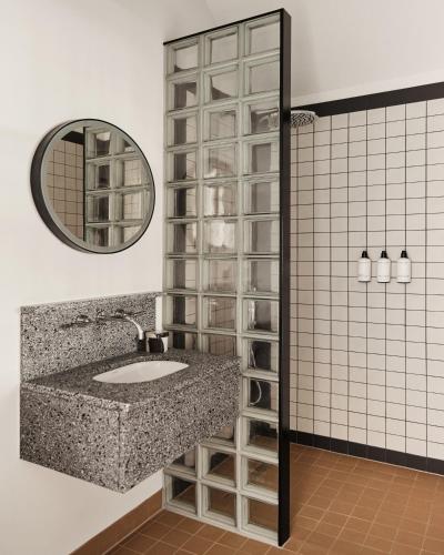 a bathroom with a sink and a mirror at Morgan & Mees Rotterdam in Rotterdam