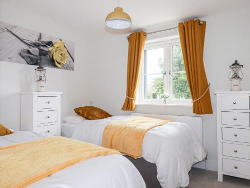 Ένα ή περισσότερα κρεβάτια σε δωμάτιο στο Chynoweth House