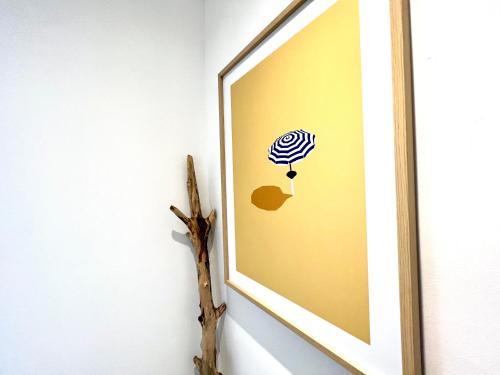 a framed picture of a zebras head on a wall at Appartement ~ Un Lundi au Soleil~ à 15 min de Lyon in Miribel