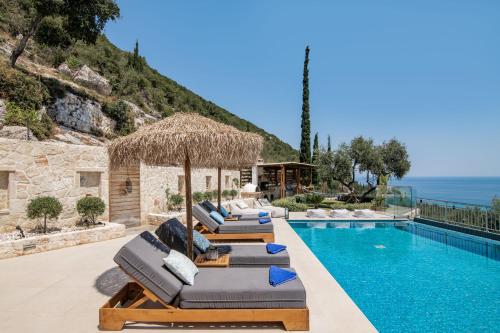 a villa with a swimming pool and a resort at Artemis Villas - Spectacular Views & Ideal For Large Groups, By ZanteWize in Khartáta