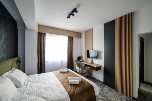 Ένα ή περισσότερα κρεβάτια σε δωμάτιο στο GBU Home Timisoara