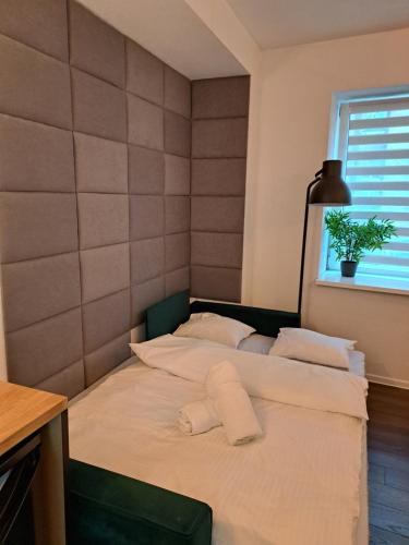 Ένα ή περισσότερα κρεβάτια σε δωμάτιο στο Apartamenty LENA 1