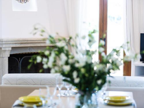 a vase of flowers on a table with a fireplace at Villa in Crete with Private Pool & Beaches Nearby in Achlades