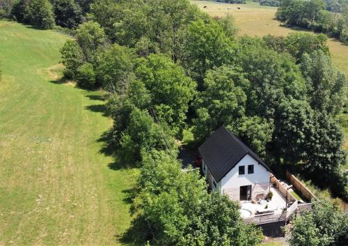 an aerial view of a house in the middle of a field at Chata Fraluq in Tatobity