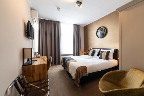 Postel nebo postele na pokoji v ubytování Hotel Montfoort