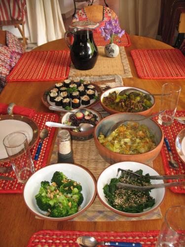 a wooden table with plates of food on it at Andean Spirit Lodge in Mollepata