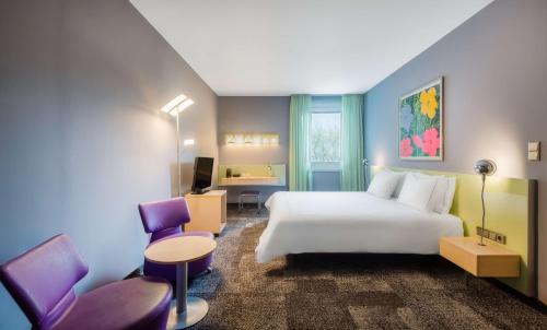 En eller flere senge i et værelse på Park Plaza Berlin
