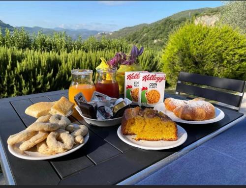 a black table with plates of food on it at La Tenuta dei Fiori in Ferentillo