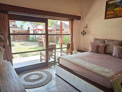 Postel nebo postele na pokoji v ubytování Villa Classico Gili Air