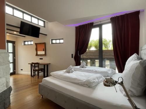 Ένα ή περισσότερα κρεβάτια σε δωμάτιο στο Residenz im Alten Wasserturm