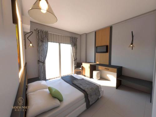 a bedroom with a large bed and a window at Colaklı Sunset Otel in Side
